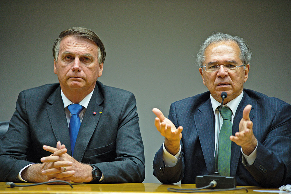 Moedas. Bolsonaro e Guedes abrem as burras, atrás da reeleição - Imagem: Andressa Anholente/Getty Images/AFP 